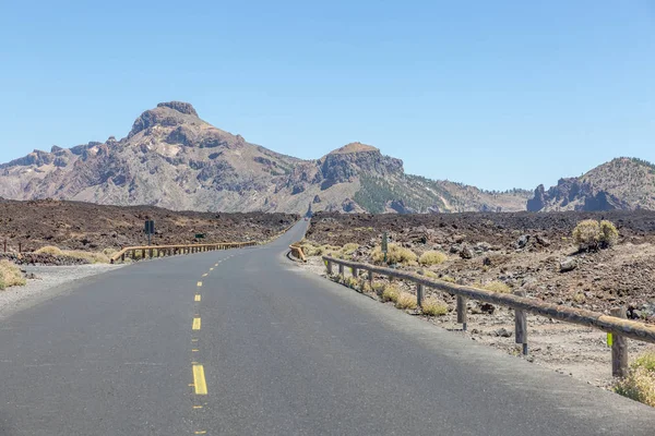 Low angle view of a desert road shot at the El Teide volcano on Tenerife, Spain