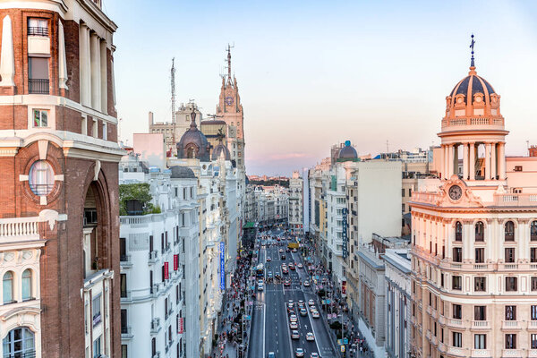 MADRID, SPAIN - JULY 17: View of Gran Via street at sunset in the part that goes down towards Plaza de Espaa. Photo taken on July 17, 2016 in Madrid, Spain.