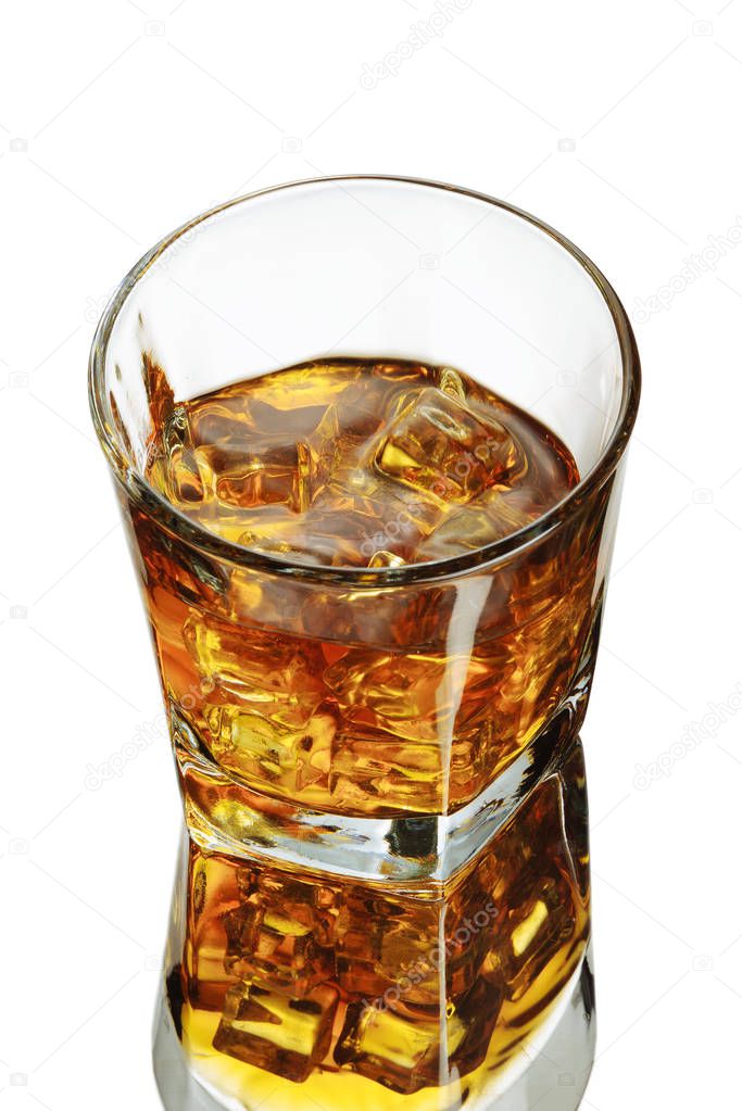 A glass of whiskey on a white background. ice cubes. Isolated