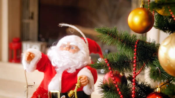 Closeup image of Santa Claus figure and Christmas tree at living room — Stock Photo, Image