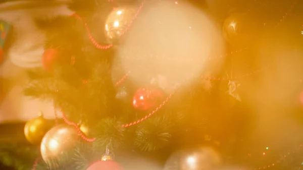 Closeup photo of decorated Christmas tree and glittering golden bokehs — Stock Photo, Image