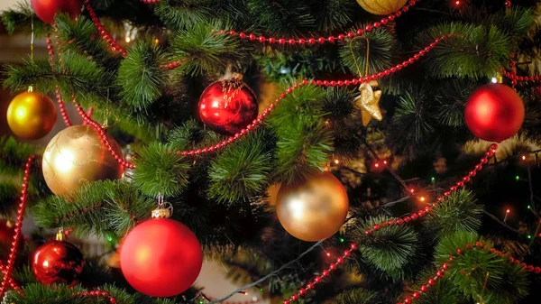 Closeup photo of Christmas tree with red and golden balls Stock Picture