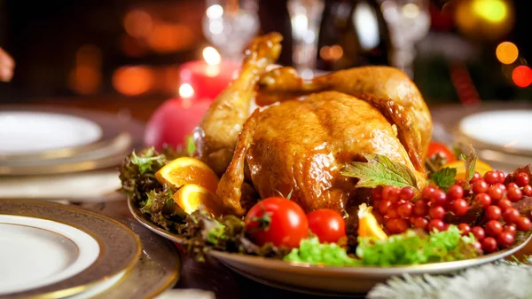 Closeup image of baked turkey on Christmas family dinner in living room