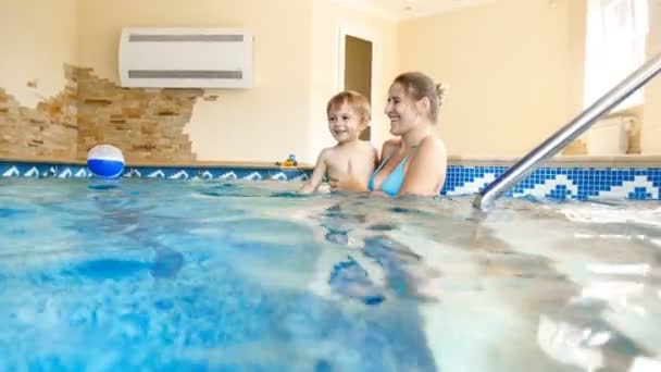 Video Young Mother Holding Her Laughing Toddler Son Swimming Pool — Stock Video