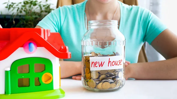 Conceptual image of taking bank loan for buying new house