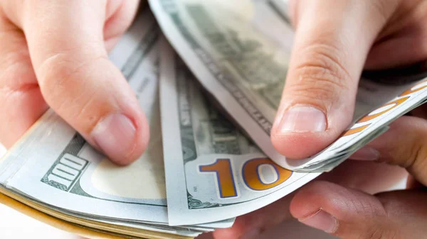 Closeup image of rich man counting big stack of money — Stock Photo, Image