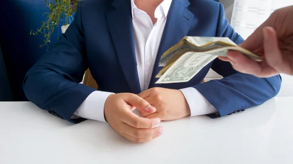 Closeup image of person giving bribe to corrupted politician in office — Stock Photo, Image