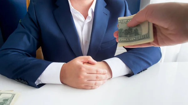 Closeup photo of person offering bribe to corrupted politician in office — Stock Photo, Image
