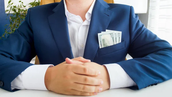 Closeup image of stack of money instead of handkerchief in businessmans jacket pocket. Concept of success and wealth — Stock Photo, Image