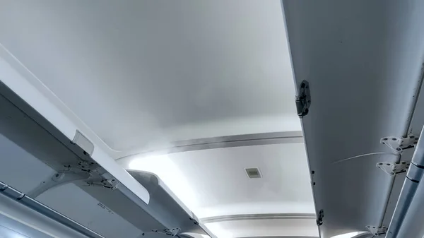 Open luggage storage area under the ceiling at airplane — Stock Photo, Image