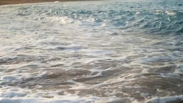 Closeup slow motion video of sea waves flowing on sandy beach — Stock Video