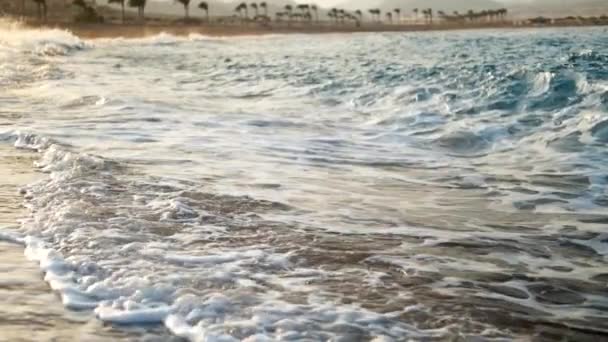 Extreme slow motion video of rolling ocean waves in sun rays. Amazing landscape of the sea — Stock Video