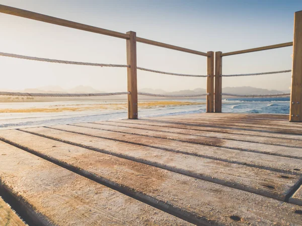 Closeup toned photo of wooden bridge in the sea. Perfect for inserting your image or placing product. Place for text. Copy space — Stock Photo, Image