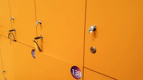 Closeup image of yellow lockers in the dressing room at gym — Stock Photo, Image