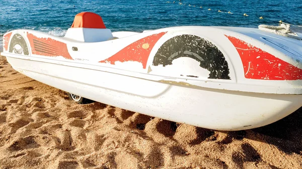 Beautiful image of old pedal catamaran boat lying on the sea shore. — Stock Photo, Image