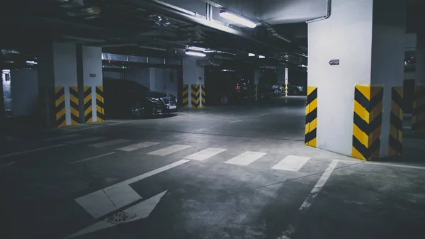 Toned image of underground car parking at office building basement — Stock Image Toned image of underground car parking at office building basement Stock Photo