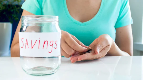 Woman counting few coins of her money savings. Concept of financial crisis — Stock Photo, Image