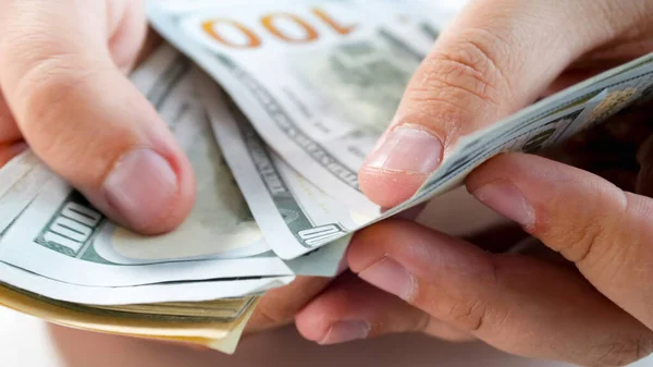 Closeup image of male businessman counting money in hands — Stock Photo, Image