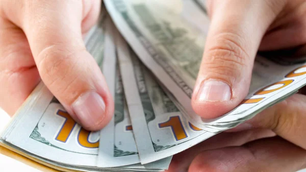 Closeup image of man holding stack of money in hands. Concept of financial investment, economy growth and bank savings — Stock Photo, Image