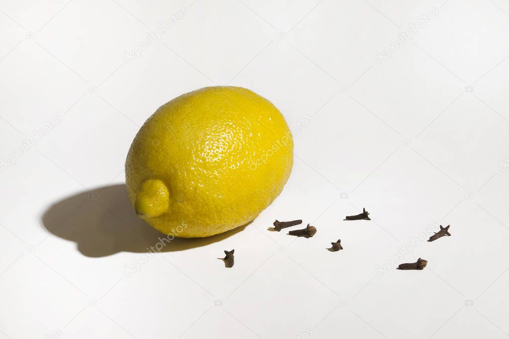 lemon with spices on a white background