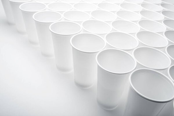 Large group of disposable plastic cups.