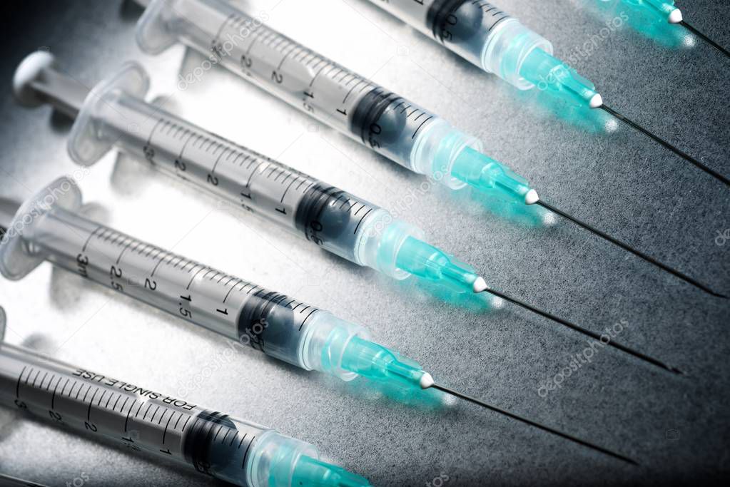 Close-up of a group of syringes.