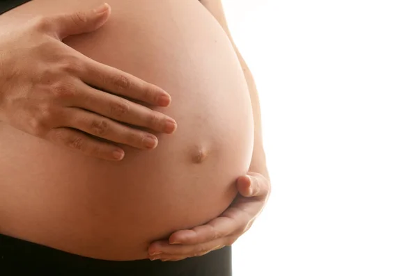 Femme Enceinte Caressant Son Ventre Avec Fond Blanc — Photo