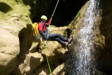 Canyoning in Fago Canyon, Pyrenees, Huesca Province, Aragon in Spain. clipart