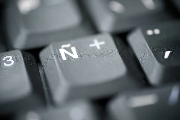 Spanish letter on a gray laptop keyboard.