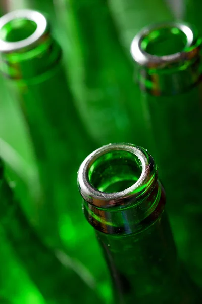 Green bottles of beer on a metal table