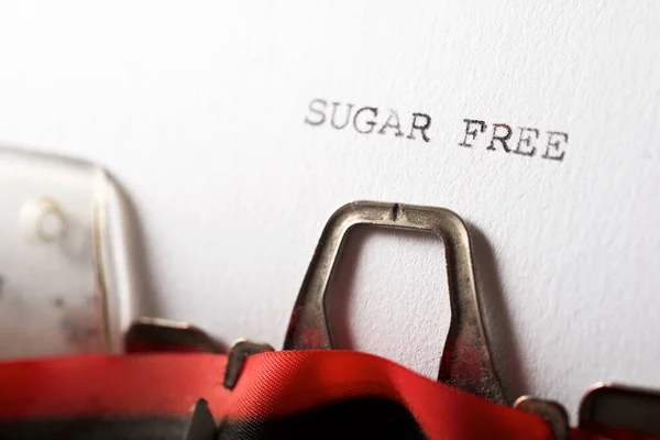 The sentence sugar free written with a typewriter.