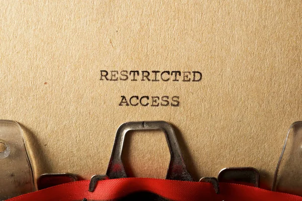 Restricted access text written on a paper.