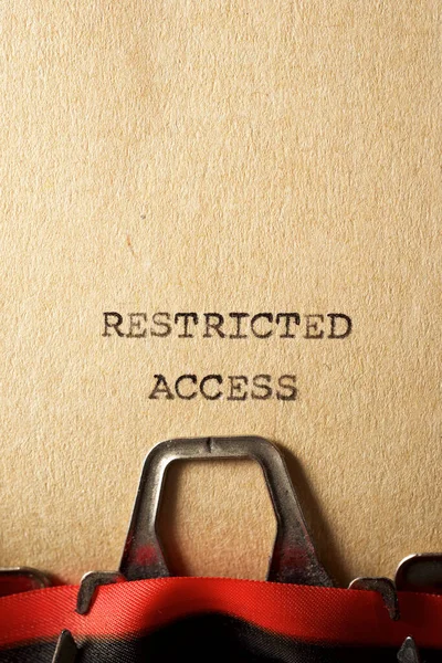Restricted access text written on a paper.
