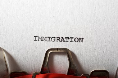 Immigration word written with a typewriter. clipart
