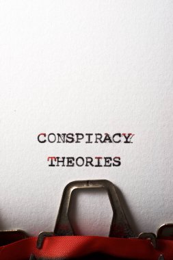 Conspiracy theories phrase written with a typewriter. clipart