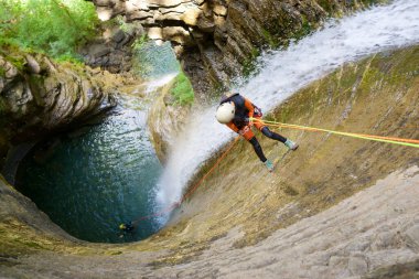 Canyoneering Furco Canyon in Pyrenees, Broto village, Huesca Province in Spain. clipart