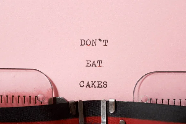 Don\'t eat cakes phrase written with a typewriter.