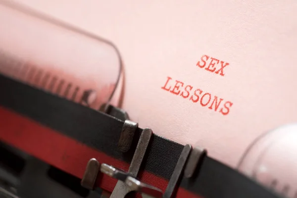 Sex lessons phrase written with a typewriter.