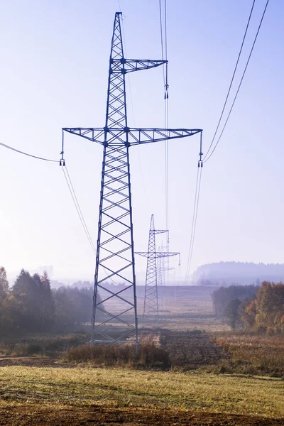 high voltage power lines. horizon line is wrong. electrical distribution station.