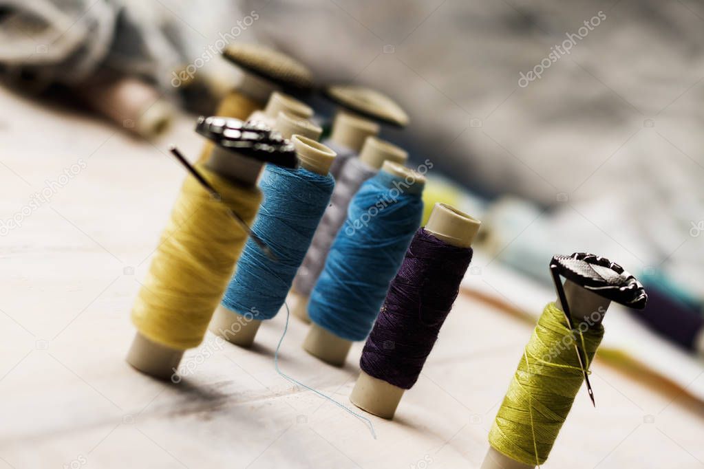 spools of thread and buttons and needles in them. The concept of escorts lead prisoners or convicted