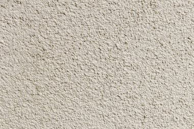 duvar. Alçı uygulanmış. küçük taşlar bileşimi. ve özel bir şekilde dövülerek.