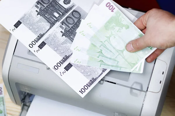 printed euro. home printer. concept crime fake money