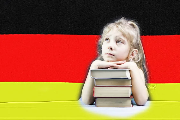 German flag. blonde girl wants to learn German. double exposure.