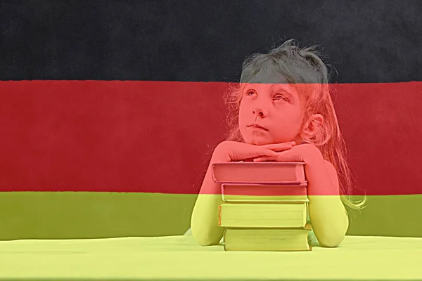 German flag. blonde girl wants to learn German. double exposure.