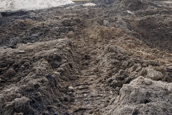 Priming. build platform trail from the movement of the tractor on the track. pressed into the ground. — Stock Photo, Image