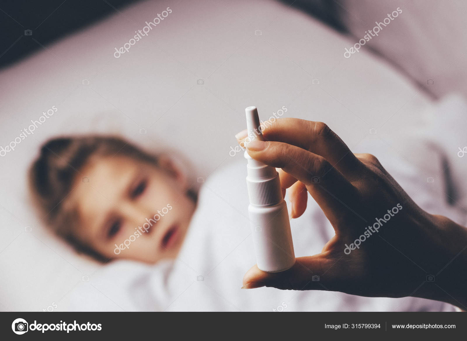 Bed. little girl with white hair lies. mom makes an injection in the ...