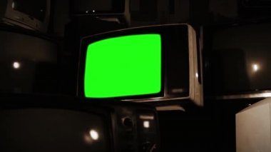 Birçok TV. sepya tonu ile eski Tv yeşil ekran.