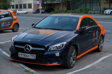 MOSCOW, RUSSIA - AUGUST 17, 2018: A car Mercedes Benz from company Belka car is available for rent. Rental car share is popular in Moscow also because they can park for free on toll parking. clipart