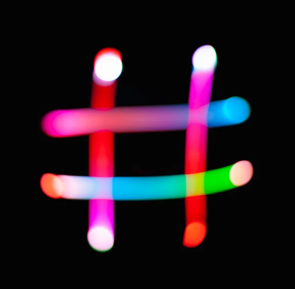 Rozjarzony Symbol Mieszania Ciemnym Tle Hashtag Znaczników Lampka Nocna Abstrakcyjne — Zdjęcie stockowe
