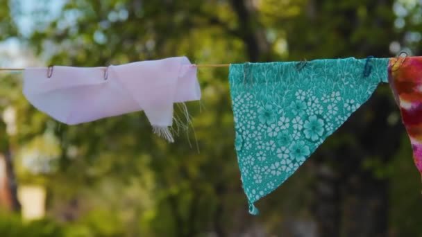 Self-made decorative flags of pieces of multi-colored fabric — Stock Video